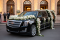Luxury SUV decorated with beautiful rose floral arrangements for weddings and events